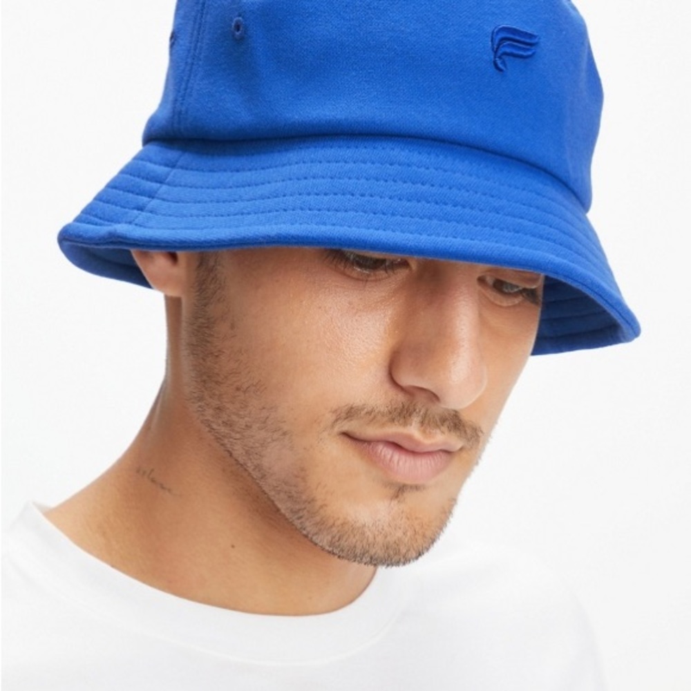 New Fabletics | unisex cobalt blue bucket hat with embroidered NYC design